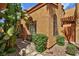 Home exterior featuring lush tropical plants and a walkway to the front entrance at 5640 E Bell Rd # 1034, Scottsdale, AZ 85254
