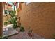 Home exterior with desert landscaping featuring rock ground cover and low maintenance desert plants at 5640 E Bell Rd # 1034, Scottsdale, AZ 85254