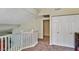 Hallway leading to bedroom featuring fresh paint, neutral carpet, and a staircase at 5640 E Bell Rd # 1034, Scottsdale, AZ 85254