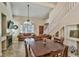 Open concept living space featuring a fireplace, comfortable seating, and a dining area with natural light at 5640 E Bell Rd # 1034, Scottsdale, AZ 85254