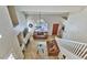 Aerial view of living room with fireplace, staircase, comfortable seating, and front door at 5640 E Bell Rd # 1034, Scottsdale, AZ 85254