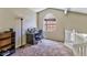 Upstairs office or loft featuring a window, neutral carpet, and light walls at 5640 E Bell Rd # 1034, Scottsdale, AZ 85254