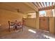 Outdoor patio featuring a ceiling fan, tiled floor, and table with four chairs at 5640 E Bell Rd # 1034, Scottsdale, AZ 85254
