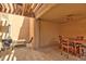 Charming outdoor patio space with tile flooring, ceiling fan, grill, and dining set; perfect for entertaining and relaxing at 5640 E Bell Rd # 1034, Scottsdale, AZ 85254