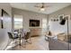 Inviting living area with large windows, natural light, and a cozy sectional sofa at 6190 N Sunrise Ln, Buckeye, AZ 85396