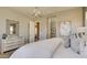Bright bedroom with an ensuite bathroom with luxury furnishings at 6190 N Sunrise Ln, Buckeye, AZ 85396