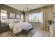 Spacious bedroom with natural light, a patterned rug, and decor lighting at 6190 N Sunrise Ln, Buckeye, AZ 85396