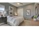 Comfortable bedroom with a window, closet doors, and side tables with lamps at 6190 N Sunrise Ln, Buckeye, AZ 85396