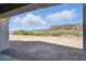 Expansive views of the lush green golf course and Arizona mountains, perfect for relaxation and recreation at 6190 N Sunrise Ln, Buckeye, AZ 85396