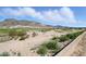 Views of the golf course and mountains under a blue sky with cumulus clouds at 6190 N Sunrise Ln, Buckeye, AZ 85396