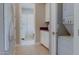 Hallway with a washer and dryer next to built-in cabinets and drawers at 6190 N Sunrise Ln, Buckeye, AZ 85396