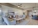 Bright living room features stylish furniture, neutral tones, and an open layout with seamless access to the dining area at 6190 N Sunrise Ln, Buckeye, AZ 85396