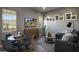 Inviting living room features a dining area, cozy seating, and a modern entertainment setup at 6190 N Sunrise Ln, Buckeye, AZ 85396