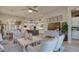 Cozy living area with a modern design, connecting seamlessly to the kitchen and dining space at 6190 N Sunrise Ln, Buckeye, AZ 85396