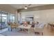 Inviting living room featuring a cozy seating arrangement, stylish decor, and sliding glass doors to an outdoor patio at 6190 N Sunrise Ln, Buckeye, AZ 85396