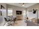 Inviting living room features a dining area, cozy seating, and modern decor for a welcoming atmosphere at 6190 N Sunrise Ln, Buckeye, AZ 85396