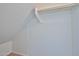 Bright, white closet features a wooden rail for hanging clothes, offering practical storage in a neat, organized space at 6843 S 9Th Ave, Phoenix, AZ 85041