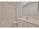 Clean bathroom featuring a shower over tub with white cabinets and tile at 6843 S 9Th Ave, Phoenix, AZ 85041