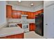 Well-maintained kitchen with neutral countertops and white appliances at 6843 S 9Th Ave, Phoenix, AZ 85041