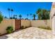 Private backyard featuring a tiled patio, secure fencing, and mature landscaping at 7802 E Rovey Ave, Scottsdale, AZ 85250
