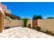 Outdoor patio area offering a serene space with decorative pavers and a privacy wall at 7802 E Rovey Ave, Scottsdale, AZ 85250