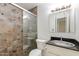 Bathroom featuring slate tile shower and granite countertop at 7802 E Rovey Ave, Scottsdale, AZ 85250