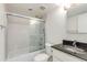 Bathroom with white tile in the shower/tub and granite countertop at 7802 E Rovey Ave, Scottsdale, AZ 85250