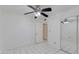 Bedroom with tile flooring, ceiling fan and mirrored closet at 7802 E Rovey Ave, Scottsdale, AZ 85250