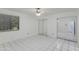Bright bedroom featuring tile flooring, mirrored closet and natural light from the window at 7802 E Rovey Ave, Scottsdale, AZ 85250