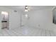 Bedroom with tile flooring and ensuite bathroom at 7802 E Rovey Ave, Scottsdale, AZ 85250