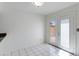 Bright dining area with tiled floor and access to the back patio through glass doors at 7802 E Rovey Ave, Scottsdale, AZ 85250