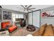 The bonus room has comfortable seating, unique decor and a ceiling fan at 7806 N Via Del Sol --, Scottsdale, AZ 85258