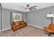 Minimalist bedroom featuring carpet, a ceiling fan, and a leather couch at 7806 N Via Del Sol --, Scottsdale, AZ 85258