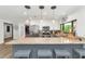 Modern kitchen with granite counters, stainless steel appliances, eat-in island, and stylish pendant lighting at 7806 N Via Del Sol --, Scottsdale, AZ 85258