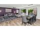 Modern living room/dining room with wood-look tile floors and a striking purple accent wall at 7806 N Via Del Sol --, Scottsdale, AZ 85258