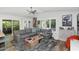 Comfortable living room with a large gray sofa, ceiling fan, and access to the backyard at 7806 N Via Del Sol --, Scottsdale, AZ 85258