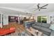 Open-concept living space with eat-in kitchen, a gray sectional sofa, and stylish modern decor at 7806 N Via Del Sol --, Scottsdale, AZ 85258