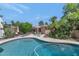 A backyard pool offers a relaxing oasis with lush tropical landscaping and inviting lounge seating at 7806 N Via Del Sol --, Scottsdale, AZ 85258