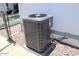Air conditioning unit on a gravel pad outside the home, with a gray exterior and visible connections at 7807 E Main St # D-26, Mesa, AZ 85207