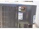 Close up shot of the side of an AC unit, shows details of safety warnings at 7807 E Main St # D-26, Mesa, AZ 85207
