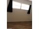 Bedroom features include laminate flooring, gray walls, black out curtains and a window for natural light at 7807 E Main St # D-26, Mesa, AZ 85207