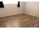 Bedroom features include laminate flooring, gray walls, and a window with black out curtains at 7807 E Main St # D-26, Mesa, AZ 85207