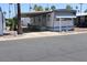 Charming single-story home with a covered carport and well-maintained landscaping at 7807 E Main St # D-26, Mesa, AZ 85207