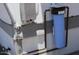 Exterior plumbing features a blue water filter and gray electrical box mounted to the home at 7807 E Main St # D-26, Mesa, AZ 85207