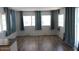 Inviting living room featuring stylish wood flooring and ample natural light from several windows at 7807 E Main St # D-26, Mesa, AZ 85207