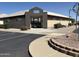 The community fitness center features a well-maintained exterior with landscaped surroundings and convenient parking at 7839 E Milagro Ave, Mesa, AZ 85209