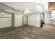 Spacious garage includes built-in storage cabinets and workbench area at 7839 E Milagro Ave, Mesa, AZ 85209