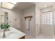 Bathroom with bright lighting and a sink at 7839 E Milagro Ave, Mesa, AZ 85209