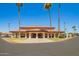 Exterior view of community building with covered entries and plenty of parking at 7839 E Milagro Ave, Mesa, AZ 85209