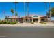 Exterior view of the golf shop, a community amenity, surrounded by palm trees at 7839 E Milagro Ave, Mesa, AZ 85209